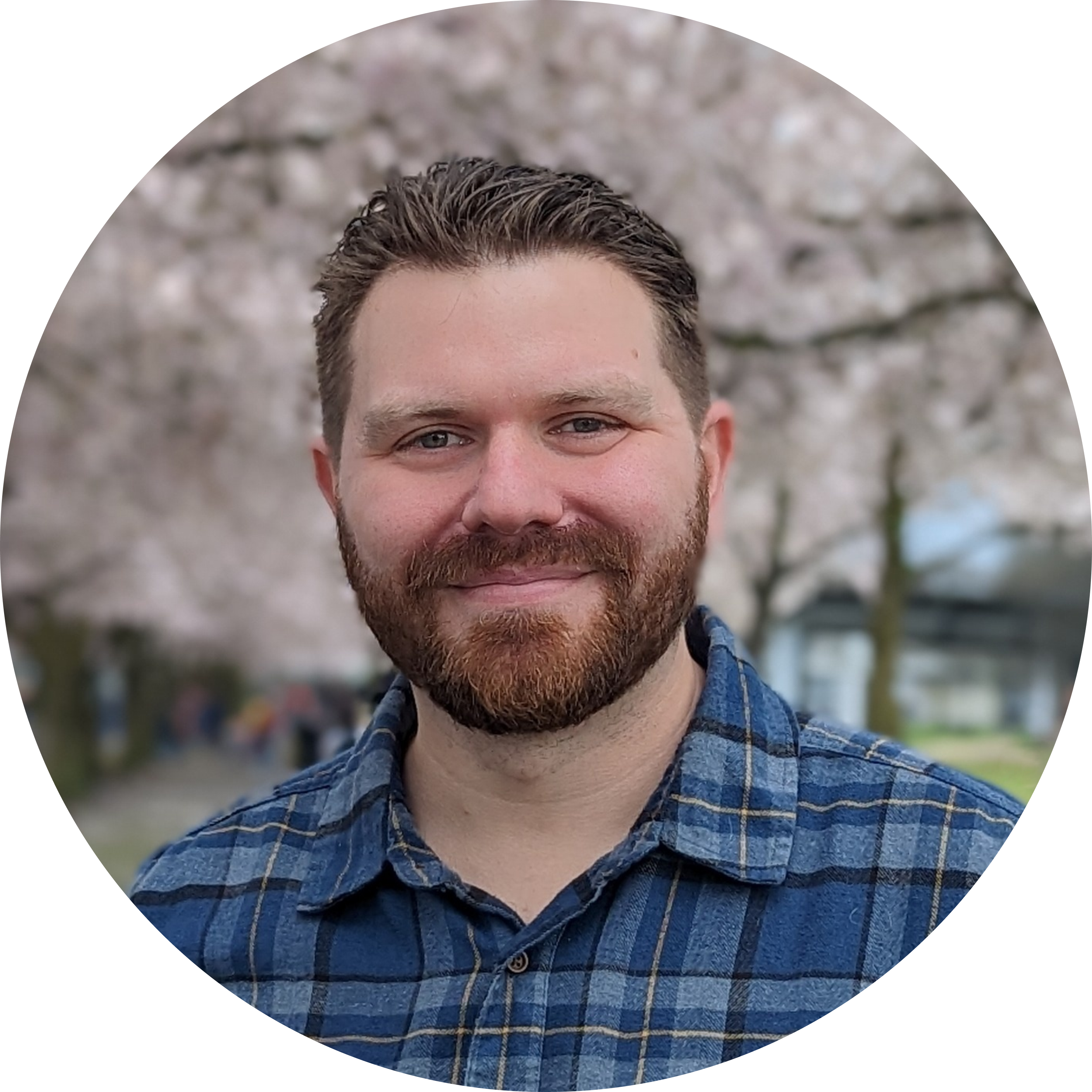 Image of me looking dashing in front of some cherry blossoms.